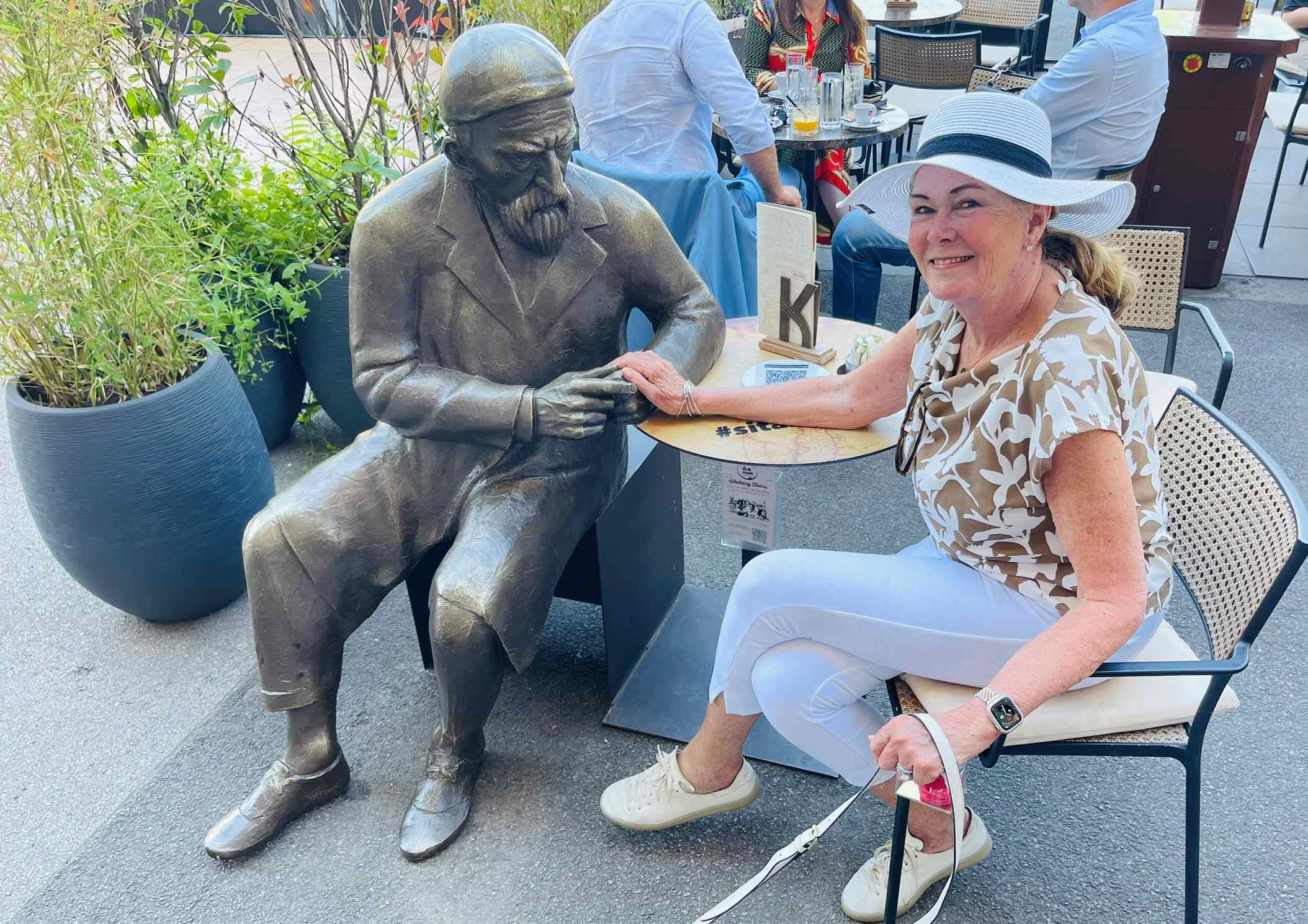 Robin sitting with Nicola Tesla in Zagreb, Croatia